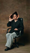 © Lustre Art Group  - Woman with oversized ear holds smartphone near her head while sitting in office chair. Concept of listening to customers, phone support, gossip, surveillance and information flow.
