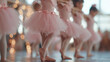 © Atchariya63 - Young ballerina pink tutu ballet class dance studio ballet shoes little girl child dancer soft focus graceful posture group practice young