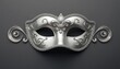 © MDJASHIM - Silver masquerade mask with ornate floral details against a dark gray background