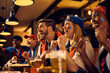 © Drazen - Excited supporters cheering for their winning team while watching live sports event in pub.
