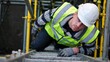 © AI-HAL8 - Engineer in a hard hat climbing up at a site
