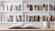 © Alal.ST - Open book and pencils in a white ceramic holder on a wooden desk with a blurred bookshelf in the background