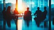 © Farah - A group of business professionals meeting in a modern conference room at sunset