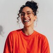 © Andrii Zastrozhnov - Young woman laughing and smiling in red shirt studio