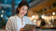 © Tania - Asian product manager conducts user testing session with early adopters in coffee shop, observing authentic reactions to prototype interface on tablets, ideal for MVP validation, customer research,