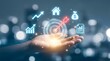 © P-Y-L  Art - Close-up of a hand with a glowing target and business growth icons, symbolizing strategy and financial goals, success icon