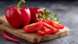 © Liliya - Fresh red bell peppers sliced on a wooden cutting board, healthy organic vegetables ready for cooking, close up with blurred kitchen background.