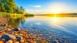 © Alyx - A Serene Lake at Sunset with Colorful Pebbles Along the Shore Reflecting Golden Sunlight and a Clear Sky