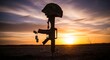 © SaadKamal - Battlefield cross memorial silhouette at sunset honoring fallen soldiers