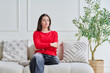 © Valerii Honcharuk - Portrait of beautiful, dreaming, pensive young teenage girl sitting on sofa