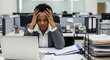 © Nina - Stressed African American Businesswoman Working on Laptop in Corporate Office