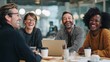 © Aditya - A lively group of colleagues sharing a moment of genuine laughter and joy during a meeting, fostering a positive and collaborative work atmosphere around a conference table.