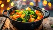 © anderson - Steaming vegetable curry in black pot on wooden surface close up