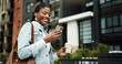 © peopleimages.com - Phone, walking and black woman in city with earphones for music, internet and coffee on morning commute. Worker, travel and person with cellphone for streaming audio, podcast and playlist in town