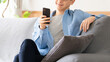 © Trickster* - 笑顔でスマートフォンを使う男性のライフスタイルイメージ, Smiling Man Using Smartphone Lifestyle Concept