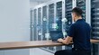 © Erika - IT specialist managing cloud server security in data center room with laptop and holographic icons showing database protection encryption locks and firewall safety measures