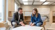 © AspctStyle - Mature male mentor explaining document to young female colleague in modern office. Career coaching and talent development for business success.