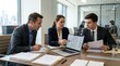 © Svitlana - Lawyers working together on a laptop in the office, legal teamwork and case review concept for professional services, corporate law and modern practice themes, focused collaboration and clean interior