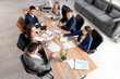 © Pixel-Shot - Business women shaking hands at table in conference room