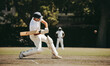 © Jacob Lund - Batsman striking a cricket ball during a match on a sunny day