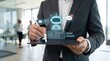 © Morgan - Businessman using tablet with holographic AI robot interface, showing project updates, team chat, and email notifications. Concept of artificial intelligence automation, smart
