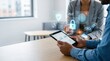 © Leo - Two business people analyzing data on tablet with floating cybersecurity icons, blockchain, biometric authentication, shield protection, privacy and secure cloud storage concept