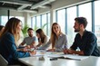 © YouraPechkin - Young Diverse Professionals Collaborating in a Bright Modern Office Meeting Room