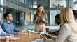 © StockSphere - Team meeting in boardroom. Business woman executive ceo leader discussing project management planning strategy working with diverse colleagues company team at office corporate board group meeting.