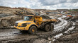 © mr_marcom - Articulating dump truck on muddy site road at earthworks project representing site logistics, earth haul, and major civil project