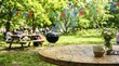 © scrdy - Wooden table with coffee and wildflowers at a summer outdoor park picnic party