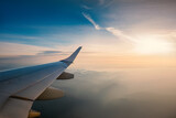 Aerial view from the plane over foggy clouds