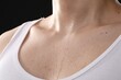 © New Africa - Young guy with sweat on his body against black background, closeup