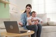 © New Africa - Telemedicine. Mother and her baby having online consultation with doctor via laptop at home