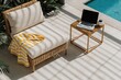 © oksa_studio - Comfortable outdoor lounge chair with yellow striped blanket and laptop on side table next to swimming pool, bathed in dappled sunlight. High quality photo