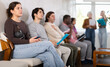 © JackF - Candidates of different ages are waiting for an interview in the office. People are sitting in line for employment, specialists are preparing for interviews and answering questions