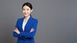© CrazyJuke - Confident Professional Portrait: A poised individual in a sharp blue suit exudes confidence and approachability, arms crossed, perfect for business or professional concepts.