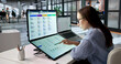 © Andrey Popov - Woman Reviewing Payroll System On Laptop