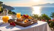 © EBG Stock Studio - Desayuno mediterráneo en terraza con vistas al mar al amanecer