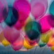 © Breezze - Vivid pink and teal balloons floating against a bright backdrop with copy space for festive event banners, birthday greeting designs and joyful party advertising