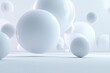 © Suparat - Floating frosted glass spheres varying in size in a pure white minimalist environment.