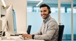 © Mostafizur - A cheerful professional wearing a headset works at a dual monitor setup in a bright, contemporary office environment. Ideal for business, marketing, and corporate lifestyle imagery.