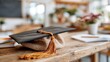 © Pinklife - A graduation cap placed stylishly on a rustic wooden desk, symbolizing education, achievement, and the journey of learning, surrounded by creative study elements.