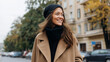 © Kateryna Arkhypova - Fashion portrait of a happy woman in trendy autumn attire posing on a city street, seasonal street style concept, with copy space