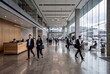 © Bunyawat - Modern Corporate Office Lobby with Motion Blur Professionals