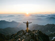 © fikri - A joyful person stands on the mountain peak under a clear sky, celebrating a successful climbing adventure and the sense of freedom found in the vast outdoor landscape