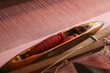 © Ruma - Handloom Shuttle on a loom.