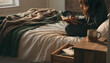 © Andrs - Young Woman Writing in Journal on Cozy Bed
