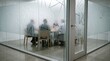© Justlight - Closeup on midsize meeting space with fullheight frosted glass walls highlighting privacy features and minimalist design elements in corporate environments.