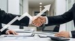 © cozycity - businessmen handshake after a good deal, office interior, modern workspace, corporate background. Business partnership meeting businessman handshake