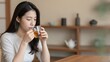 © CrazyJuke - Serene Sip: A moment of tranquility captured as a person delicately savors a warm beverage, embodying the essence of peace and relaxation.